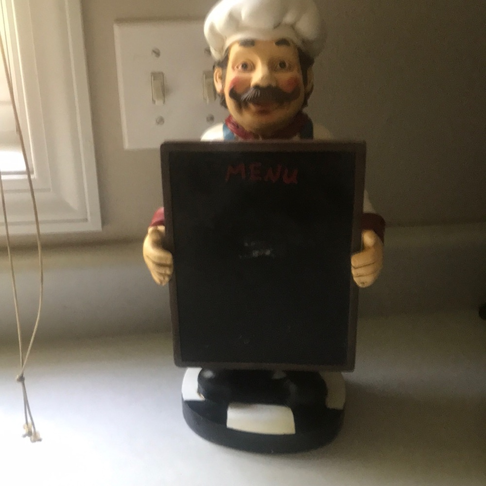 Chef Holding a Menu Board